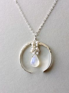 Crescent Moon Necklace Half Moon Moonstone by BellaAnelaJewelry Artisan Necklace With Moon Charm, Artisan Crescent Moon Charm Necklaces, Artisan Crescent Moon Charm Necklace, Unique Crescent Shaped White Jewelry, Unique White Crescent Jewelry, Artisan Moon Charm Necklaces, Artisan Moon Phase Jewelry In Moon Shape, Delicate Moon Phase Pendant Jewelry, White Sterling Silver Necklace With Moon Charm