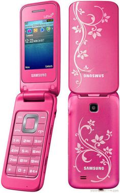 a pink samsung flip phone with white flowers on the front and bottom cover, sitting upright