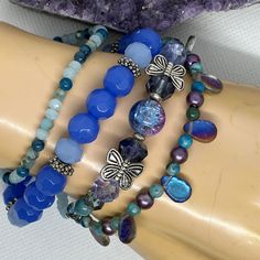 This unique bracelet set is part of my FLUTTER DREAM Collection of jewelry, created in 2023 ~  This collection features themes of flight and fantasy such as butterflies, fairies, dragonflies, & wings, and has a vivid colour story of blue, green, purple, chromatics, iridescence, silver & a touch of gold.  Any or all of the pieces in the entire collection were created to be worn together: Mix and match and have some fun!  Many lovely & unique combinations are possible. Create your own set by choos Blue Whimsical Bracelets For Gifts, Blue Whimsical Bracelets For Gift, Whimsical Blue Bracelets For Gifts, Blue Fantasy Jewelry For Jewelry Making, Fantasy Blue Jewelry For Jewelry Making, Handmade Blue Fairycore Jewelry, Colour Story, Blue Lilac, Purple And Silver