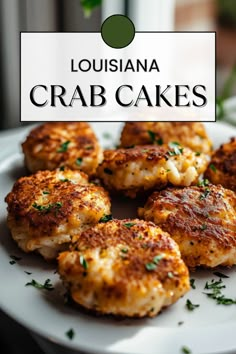 crab cakes on a white plate with the words louisiana crab cakes above it and below