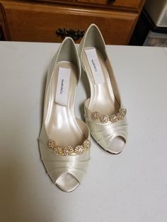 "THIS LISTING IS FOR: US Size 8W Ivory, as shown in pics is ready to ship; HEEL: 1 3/4\" INSIDE LENGHT: 9 3/4\" MEASURE YOUR FEET LENGHT TO ENSURE FIT, FINAL SALE! Wedding Peep toes satin shoes! Hand embellished with a beautiful set of Crystals brooches Please look at the pictures for details! Heel hight in the picture is: 1 3/4'' inches, OTHER SIZES AVAILABLE: COLORS OF SHOES: WHITE, IVORY, OFF-WHITE, CHAMPAGNE COLORS OF JEWELRY: GOLD, OR SILVER To order color samples: www.etsy.com/listing/1297 Classic Open Toe Wedding Heels, Open Toe Kitten Heels For Wedding, Elegant Gold Fitted Kitten Heels, Elegant Low Heel Heels For Wedding Reception, Elegant Gold Kitten Heels, Elegant Open Toe Champagne Wedding Shoes, Elegant Champagne Open Toe Wedding Shoes, Classic Gold Heels For Wedding, Gold Round Toe Kitten Heels