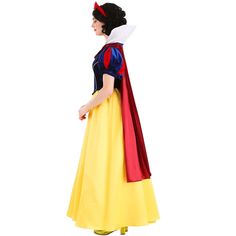 a woman in a yellow dress and red cape