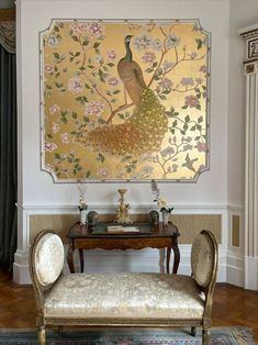 an ornately decorated room with a peacock painting on the wall