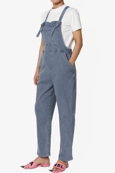 Embrace everyday chic with these denim overalls that blend utility and style. Their adjustable straps and relaxed fit ensure all-day comfort, perfect for casual outings.Made with a soft cotton blend and durable twill, these versatile one-piece jumpsuits are a wardrobe staple for any season.The cropped tapered legs and bib pocket add a contemporary touch to the timeless design, while slant pockets merge convenience with streetwear vibes.Ideal for casual travel, weekend wear, or special occasions, Everyday Dark Wash Overalls With Pockets, Casual Everyday Overalls For Fall, Casual Everyday Fall Overalls, Utility Denim Blue Jumpsuit With Bib Front, Denim Blue Bib Front Utility Jumpsuit, Utility Style Denim Blue Bib Front Jumpsuit, Relaxed Fit Washed Overalls For Fall, Utility Denim Jumpsuit With Adjustable Straps And Bib Front, Casual Cotton Shortalls With Straight Leg