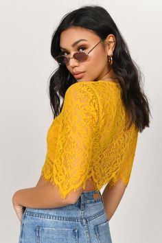 A Crop Top That You Can Take To All Your Upscale Events. The Yvonne Lace Yellow Crop Top Features Gorgeous Half Sleeves, A Plunging Neckline, And A Beautiful Scallop Hem. Pair This Dressy Top With Its Matching High Waisted Skirt For An Evening Look You'Ll Want To Put On Repeat. Chic Lace V-neck Crop Top, Spring Lace Crop Top For Night Out, Chic V-neck Lace Crop Top, Flirty Fitted Crop Top With Short Sleeves, Fitted Flirty Short Sleeve Crop Top, Spring Lace Crop Top For Brunch, Chic Short Sleeve Crop Top For Brunch, Elegant Short Sleeve Crop Top For Spring, Spring Lace Crop Top With Short Sleeves