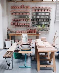 a room filled with lots of pots and tables