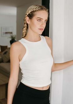 The Bliss Rib Tank is the go-to tank for any look. Whether you're styling it with yoga pants, jeans, or a skirt, its ultra-soft Airlume cotton and mid-length cut provide a comfortable, stretchy fit that perfectly frames your body. Plus, the timeless high-neck and racerback silhouette make it a staple style for any wardrobe. FitThis style runs true to size. 19" long measuring from a small. Size range = XS 0-2, S 2-4 M 6-8, L 10-12, XL 14-16. FabricMoisture wicking, ultra soft micro rib jersey, 52 Crochet Tank Top, Tank Top Dress, A Skirt, Pants Jeans, Muscle Tanks, Yoga Leggings, Classic White, Crop Tank, Everyday Look