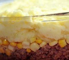 a close up of a cake with corn on top