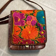 Never Worn. Embroidered Floral Purse - Mexican Embroidery With Shoulder Strap. Leather Purse. Brown Leather Bags With Embroidered Logo, Embroidered Brown Rectangular Satchel, Multicolor Bags With Embroidered Logo For Everyday Use, Brown Bag With Embroidered Logo For Everyday Use, Brown Embroidered Rectangular Satchel, Casual Brown Embroidered Shoulder Bag, Red Embroidered Leather Bag, Embroidered Satchel For Everyday Use, Red Embroidered Leather Shoulder Bag