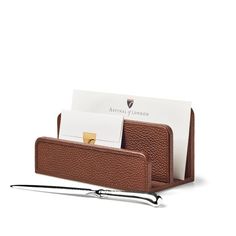 a brown leather business card holder