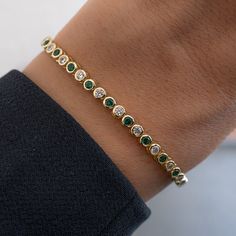 "Rounded bezel tennis bracelet featuring alternating emerald and cubic zirconia stones. Looks absolutely gorgeous and high-end! Handmade with love, care and attention to detail! - - - D E T A I L S - - - * Made of 925 Sterling Silver * THICK plating of 14k Gold or Rhodium  * 6.25\" and 6.75\" Bracelet Lengths * 3mm Thickness * Made of highest quality cubic zirconia  * VERY HIGH QUALITY * Nickel-free & Hypoallergenic - will not irritate skin! * Box Clasp Closure BRACELETS ON MODEL 🤍  https://www.etsy.com/listing/1615215846/tennis-bracelet-gold-bracelet-diamond?click_key=39e4b873348cd5527a8200b2bf850b35e8df6cdc%3A1615215846&click_sum=07685760&ref=shop_home_active_35&pro=1&frs=1 🤍 https://www.etsy.com/listing/1388355106/tennis-bracelet-gold-tennis-bracelet?click_key=e8f03881458e404bac08be4a Luxury Green Women's Tennis Bracelet, Simple Tennis Bracelet, Unique Diamond Bracelet, Latest Bracelet Designs Gold For Women, Expensive Bracelets, Emerald Bracelets, Emerald Tennis Bracelet, Tennis Bracelet Gold, Tennis Jewelry