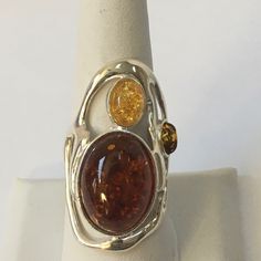 This Sterling Silver Amber Ring Is A Beauty! It Has 2 Amber Stones And A Very Nice Light Amber Stone As Well. It Is Approx. 1 1/2” High And Approx. 1 1/4” Wide. As With All My Items, Unless Otherwise Stated, This Is New Never Worn. I Reply To Questions Via Poshmark “Comments” Only, Not To Private Email/Text. Thank You. Shifting Closet, Rose Gold Opal Ring, Moon And Star Ring, Artistic Ideas, Unusual Rings, Amber Crystal, Amber Ring, Trendy Ring, Eternity Band Ring