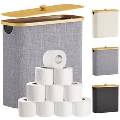 several rolls of toilet paper are stacked in front of a canvas box with wooden lid