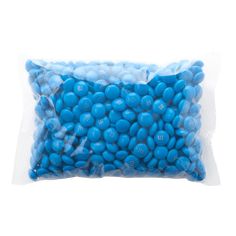 a bag of blue candies sitting on top of a white table