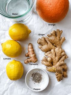 lemons, ginger, turment, and other ingredients to make an orange smoothie