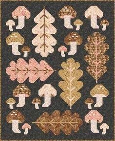 an image of a quilt with mushrooms and leaves on it's border, in brown tones