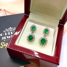 ONE OF A KIND HANDCRAFTED EARRINGS. IN STOCK! READY FOR SHIPPING! GIFT WRAP AVAILABLE! FREE UPS EXPRESS! STUNNING 2.98TCW, Certified Zambian Emerald earrings. UNIQUE DESIGN! ONE OF A KIND! TRANSPARENT, SPARKLING EMERALDS IN PAIR! Extremely rare! Surrounded by TOP GRADE, E/VS DIAMONDS! Set in 18K solid white gold earrings. These earrings will absolutely dazzle anyone who sees them! Our jewelry are specially designed, and are delicately handcrafted by local, professional goldsmiths, who have had d Formal Gia Certified Oval Earrings, Oval Diamond Earrings Hand Set, Formal Gia Certified Dangle Diamond Earrings, Gia Certified Fine Jewelry Earrings For Formal Occasions, Oval Fine Jewelry Bridal Earrings, Gia Certified Emerald Earrings For Formal Occasions, Gia Certified Formal Drop Earrings, Oval Diamond Bridal Earrings Gift, Oval Bridal Earrings Fine Jewelry