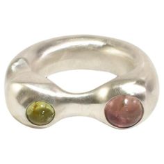 Sterling hand carved and cast organic shaped ring with two round tourmaline stones in pink and green. Each piece is hand carved and finished in Virginia by Shauna Dunn of First Edition. Material: Sterling silver, tourmaline. We recommend storing in a dry place and periodic polishing with a cloth. Cast In Place Jewelry, Alligator Ring, Organic Jewellery, Valentines Collection, Emerald Blue, Organic Rings, Organic Jewelry, Septum Jewelry, Tourmaline Stone