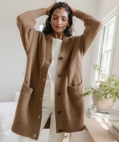 Cottage Cardigan Tan With a dramatically oversized fit you'll want to live in, this vintage-inspired knit is the perfect addition to any sweater rotation.We pair this with everything from dresses to denim—or layered over a lightweight turtleneck for the ultimate cozy ensemble.41% polyamide, 32% baby alpaca, 27% merino wool.Made in China of Italian fibers. Everyday Soft Knit Button-up Outerwear, Textured Knit Button-up Sweater For Layering, Classic Fall Button-up Sweater Coat, Cozy Long Outerwear For Layering, Oversized Chunky Knit Sweater For Work, Oversized Workwear Sweater With Chunky Knit, Chic Oversized Sweater For Daywear, Cozy Knitted Outerwear For Work, Cozy Button-up Cardigan For Loungewear