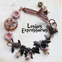 ◾Lots of pretty pink Czech glass flower beads and small beads with dangle leaf chain and an adorable bird lobster claw.  ◾Length: 7" **I measure bracelet \s on a mandrel not by using a ruler. If you need it bigger I can add some chain. Just let me know in the comments. ...in the Garden is a colorful and whimsical collection of jewelry that shares a theme of flowers, birds, insects and other things you see in a garden. Beads are mostly Czech glass or Art beads made in ceramic, clay, resin or pain Vintaj Jewelry, Czech Beads Jewelry, Czech Glass Bead Bracelet, Bead Bracelet Ideas, Czech Glass Jewelry, Candy Bracelet, Vintage Jewelry Repurposed, Spring Bracelet, Whimsical Jewelry