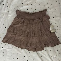 New With Tags Altar’d State Mini Ruffle Skirt! This Is In The Color Mocha, Like A Lighter Brown/Tan. It Has A Inner Lining!! Chic Brown Ruffled Bottoms, Brown Skirted Bottoms With Ruffled Skirt, Brown Ruffled Skirt Bottoms, Brown Skirted Bottoms With Ruffled Detail, Brown Ruffled Skirted Bottoms, Beige Tiered Lined Skirt, Beige Ruffled Relaxed Bottoms, Beige Ruffled Flowy Skirt, Spring Brown Tiered Skirt