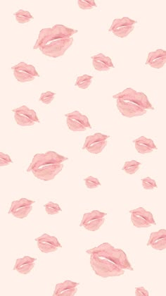 pink lips on a white background with lots of smaller ones in the air and one is slightly open