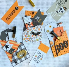 several halloween tags laid out on a table