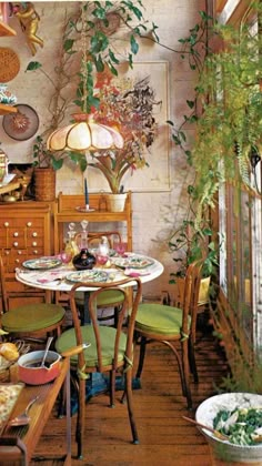 a dining room filled with lots of furniture and plants