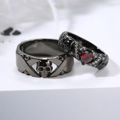 Spoil the most important Couple in your life by treating them to a Gothic Skull Couple Ring . This sparkling 925 Sterling Silver Ring Jewelry Set design is best suited for Couple Ring with Garnet Red Cubic Zirconia . Gay Promise Ring, Viking Rings Women, Gothic Wedding Rings His And Hers, Bf And Gf Matching Rings, Coffin Shaped Wedding Ring, Cool Wedding Rings Couple, Green Engagement Ring Men, Space Themed Wedding Rings, Gothic Promise Rings