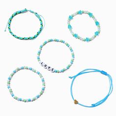 Show your love to the world with this pretty bracelet set in shades of blue. It includes three beaded stretch bracelets and two adjustable bolo bracelets that feature "LOVE", heart, and floral accents.Pack Size: 5Fit: Stretch, BoloMaterial: Plastic - Claire's Turquoise Love Beaded Stretch Bracelet Set - 5 Pack Manifest Board, Preppy Jewelry, Amazing Life Hacks, Fashionable Jewelry, Coastal Chic, Pretty Bracelets, Beaded Stretch Bracelet, Turquoise Jewelry, Stretch Bracelet