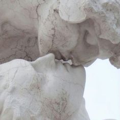 a close up view of the face and head of a statue