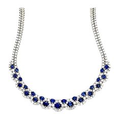 A stunning ladies 18k White Gold Natural Royal Blue Sapphire and Diamond Necklace made in the Province of Alessandra, Italy. The sapphires are Sri Lankan material and custom cut to a perfectly calibrated layout that slightly graduates. The natural round brilliants are collection quality (colorless and VS in clarity). The 16" necklace weighs 60+ grams and contains 303 stones (278 round brilliant diamonds weighing appx 19ct and 25 sapphires weighing appx 18ct). Luxury Sapphire Necklace With Baguette Cut, Luxury Gemstone Necklaces With Round Stone, Luxury Sapphire Single Strand Jewelry, Necklace Blue Stone, Italian Necklace, Royalty Fashion, Boot Jewelry, Colorless Diamond, Royal Jewelry