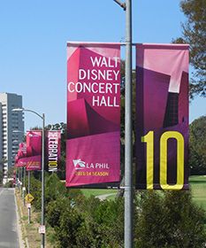 the street is lined with banners for walt concert hall