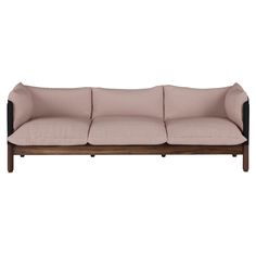 a beige couch with black legs on a white background