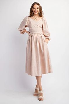 This dress features a sweetheart neckline and bubble sleeves with elasticized cuffs, as well as a smocked waistline and back. The adjustable top allows for multiple looks, and the side pockets add functionality. Its loose and flowy fit offers comfort and style. Length measures at 45.5" with a bust measurement of 14.5". Casual Puff Sleeve Dress With Lantern Sleeves For Brunch, Casual Midi Dress With Lantern Sleeves For Brunch, Casual Puff Sleeve Dress With Balloon Sleeves For Spring, Casual Puff Sleeve Dress For Spring, Chic Dresses With Smocked Cuffs And Lantern Sleeves, Chic Dresses With Lantern Sleeves And Smocked Cuffs, Summer Dress With Balloon Sleeves And Smocked Cuffs, Casual Puff Sleeve Dress With Relaxed Fit For Spring, Billowy Peasant Dress With Gathered Sleeves