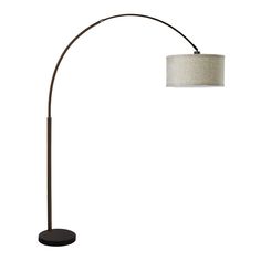 a floor lamp with a white shade on it and a black base underneath the light