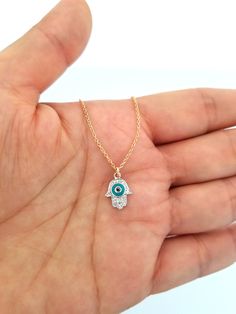 This Diamond and Turquoise Evil Eye Hamsa Charm features closed ring, you use it alone as a charm, or combine it with other charm to complete your necklace or bracelet. Chain doesn't include Style: Diamond Hamsa Charm Size approx. 12mm Stone type: Diamond Number of diamond: 16 pieces Total carat weight: 0.06ct Material: 14K Gold Color: Yellow, White, Rose (Choose From Drop Box) Country of origin: United States Finished: High Quality Sold by piece Please Check Out Our Chain https://www.etsy.com/l Yellow Gold Evil Eye Jewelry For Good Luck, 14k Gold Amulet Jewelry For Good Luck, 14k Gold Evil Eye Amulet Jewelry, Amulet Style 14k Gold Jewelry With Charms, Fine Jewelry Pendant For Good Luck, Spiritual 14k Gold Jewelry With Adjustable Chain, Fine Jewelry In 14k Gold With Turquoise, 14k Gold Turquoise Fine Jewelry, Turquoise 14k Gold Fine Jewelry