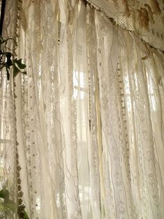 the curtains in this room are made from laces and crocheted with beads