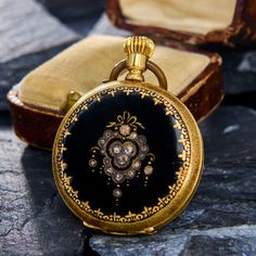 This stunning antique ladies pocket watch features a beautifully black enameled case set with rose cut diamonds.  The inside dust cover is engraved "Remontoir Pendant Cylindre Huit Rubis No 30809."  The pocketwatch is crafted in solid 18k yellow gold with the bow being gold-tone.  The pocket watch currently ticks but we are not able to warranty watch movements. These beautiful antique pocket watches are typically for fashion rather than for keeping accurate time.  There is a very light enamel loss in a few spots. Antique Engagement Rings Sapphire, Estate Jewelry Rings, Antique Pocket Watch, Wedding Ring Diamond Band, Pocket Watch Antique, Expensive Jewelry, Antique Engagement Rings, European Cut Diamonds, Pocket Watches