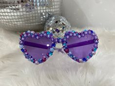 Be the life of the party on your big day with a pair of bedazzled birthday glasses! These glasses are the perfect gift for any birthday celebration and are a unique gift that's sure to shine. All of our glasses are custom made per order, allowing for changes in design, phrasing, and colors. Party proof glasses are the way to go, our glasses are guaranteed to stay intact and if for any reason you aren't satisfied with your purchase we offer a 100% money back guarantee.  *Custom made for each orde Fun Carnival Party Supplies As Gifts, Trendy Personalized Party Sunglasses, Purple Party Sunglasses, Playful Party Sunglasses Personalized, Fun Customizable Sunglasses For Party, Fun Personalized Sunglasses For Party, Fun Sunglasses As Valentine's Day Gift, Fun Sunglasses For Valentine's Day Gift, Customizable Fun Sunglasses For Parties