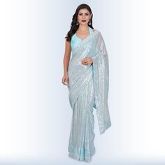 Introducing our stunning "1 Minute Sequin Saree - Baby Blue"! ✨ Elevate your elegance with this georgette masterpiece that effortlessly combines tradition with modern style. 🌟Designed for the busy, modern woman, this saree comes pre-stitched, saving you precious time on draping. Its mesmerizing baby blue hue is complemented by intricate sequin detailing that sparkles with every move you make. 💃The included backless blouse adds a touch of allure, making you the center of attention at any event. Fitted Blue Pre-draped Saree For Festive Occasions, Fitted Chiffon Blouse For Reception, Light Blue Georgette Traditional Wear For Wedding, Light Blue Georgette Wedding Dress, Elegant Georgette Blouse For Celebrations, Fitted Light Blue Blouse Piece For Wedding, Fitted Chiffon Pre-draped Saree For Wedding, Blue Georgette Saree For Wedding, Festive Blue Georgette Pre-draped Saree