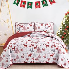 a christmas themed bed spread with red and green decorations