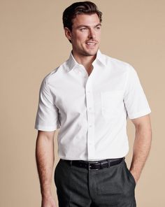 100% 2-ply cotton, Available in classic and slim fit, Non-iron, Classic Collar, Classic and slim fit: back pleats, Short sleeve, Chest pocket, Machine washable - Non-Iron Poplin Short-Sleeve Shirt - White | Men's Charles Tyrwhitt Non-Iron Poplin Short-Sleeve Dress Shirt - White Size Medium Cotton Relaxed Fit Short Sleeve Business Shirt, Classic Dress Shirt For Office With Relaxed Fit, Classic Relaxed Fit Dress Shirt For Office, Classic Formal Tops With Relaxed Fit, Classic Summer Dress Shirt For Work, Classic Short Sleeve Shirt With Welt Pockets, Classic Dress Shirt With Welt Pockets For Work, Classic Short Sleeve Shirt With Spread Collar For Work, Classic Cotton Formal Short Sleeve Shirt