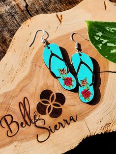 Lightweight basswood dangle earrings- These little flip flops feature beautiful hibiscus flowers. They make the perfect fun accessory for summertime!  Earrings are 2 in long and 1.75 in wide. Each earring weighs 1 gram. Nickel Free Flower Earrings For Summer, Bohemian Flower Earrings For Summer Beach, Bohemian Flower Earrings For Summer Vacation, Bohemian Summer Flower Earrings For Vacation, Adjustable Flower Earrings For Summer Vacation, Summer Vacation Jewelry With Flower Shape, Summer Flower Jewelry For Vacation, Flower-shaped Summer Vacation Jewelry, Summer Vacation Flower-shaped Jewelry