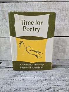 a book on time for poetry sitting on a table