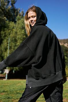 So slouchy and ultra-comfy, this oversized hoodie features adjustable drawstrings and drop-shoulder sleeves with banded hemlines. **Fit:** Slouchy, oversized fit, hip-length **Features:** Soft fabrication, hooded-neckline with adjustable drawstrings, ribbed hem and cuffs, drop-shoulder sleeves, slits at both sides, high-low hem, seam detailing throughout, hand pockets **Why We <3 It:** This easy hoodie can be pulled on pre- or post-workout or with your favorite lounge bottoms.