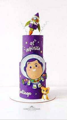 a purple cake with an astronaut on top