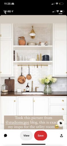 the kitchen is clean and ready to be used by someone who likes it on their phone