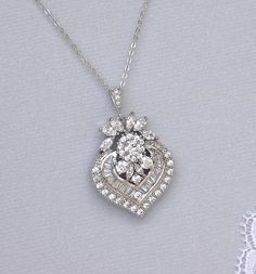 "We have designed our Camille crystal bridal necklace in an elegant and modern-vintage style which is studded with marquise, baguette and round cut crystals A timeless accessory. WE have earrings to match as in our last two photos and they can be found at: https://www.etsy.com/listing/286408497 https://www.etsy.com/listing/225414085 This listing is for the necklace ONLY. 💜 Available in rose gold, silver (rhodium) and gold Measures: L = 16.5\" (42 cm) + 2\" extender chain (optional) Pendant= 1.7 Wedding Diamond Necklace With Jewels, Exquisite Teardrop Pendant Jewelry For Wedding, Classic Diamond Pendant Necklace For Weddings, Elegant Silver Marquise Cut Diamond Necklace, Wedding Crystal Diamond Necklace With Elegant Design, Exquisite Wedding Diamond Necklace With Sparkling Stones, Pear-shaped Necklace With Diamond Accents For Wedding, Oval Brilliant Cut Necklace For Wedding, Pear-shaped Brilliant Cut Wedding Necklaces