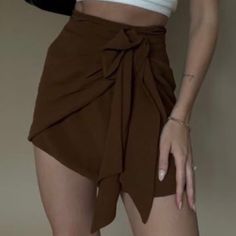 Skirt With Front Tie. Size Small Brown Mini Skirt For Date Night, Trendy Summer Mini Skirt For Date Night, Trendy Mini Skirt For Date Night In Summer, Casual Mini Wrap Skirt For Summer, Casual Mini Length Wrap Skirt For Summer, Casual Summer Mini Wrap Skirt, Chic Brown Mini Skort, Trendy Brown Skirt For Date Night, Casual Brown Asymmetrical Skirt